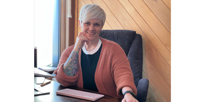 Dr. Rachael O'Connell sitting at her desk.